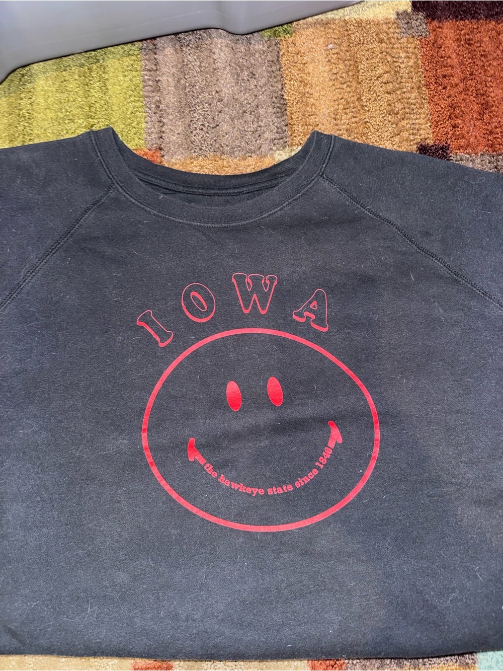 State of Mind Black Sweatshirt with Red Iowa Smiley Graphic